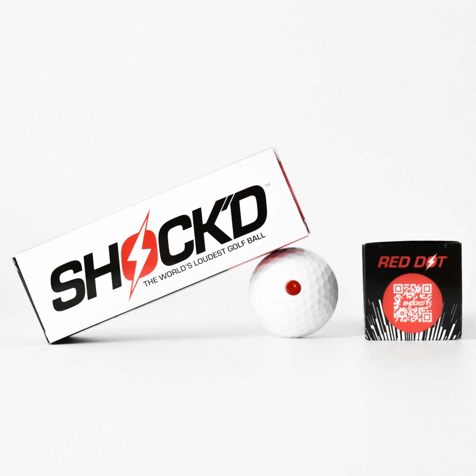 SHOCK'D prank golf ball with raised red dot in branded sleeve packaging