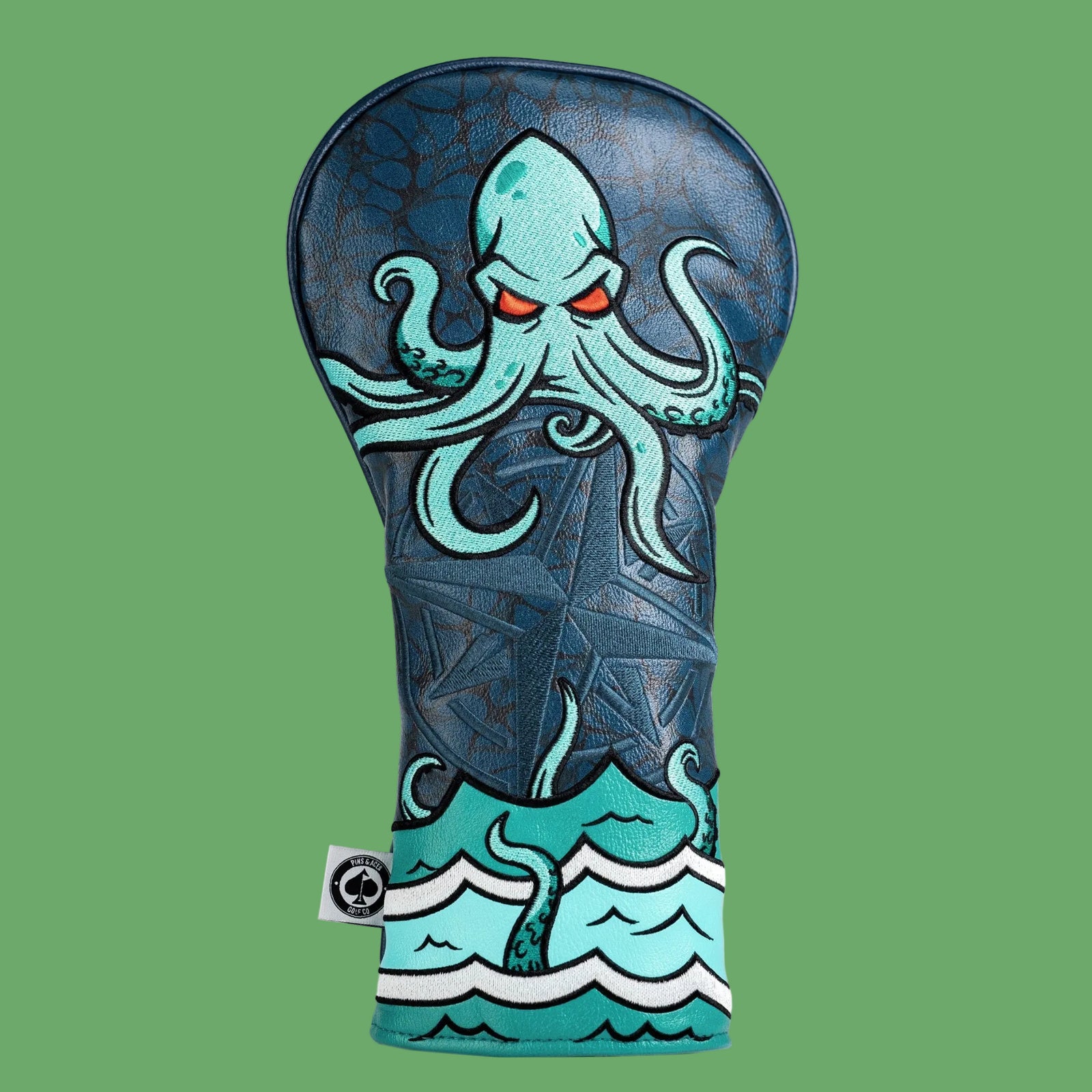 Kraken golf driver headcover in navy vegan leather with embroidered teal octopus and ocean wave design