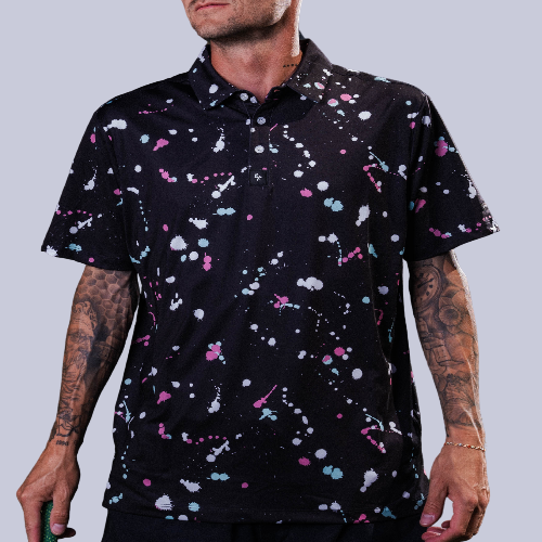 Men’s black polo with gray-white drip-speck pattern – urban-inspired, breathable, stretch-performance ready.