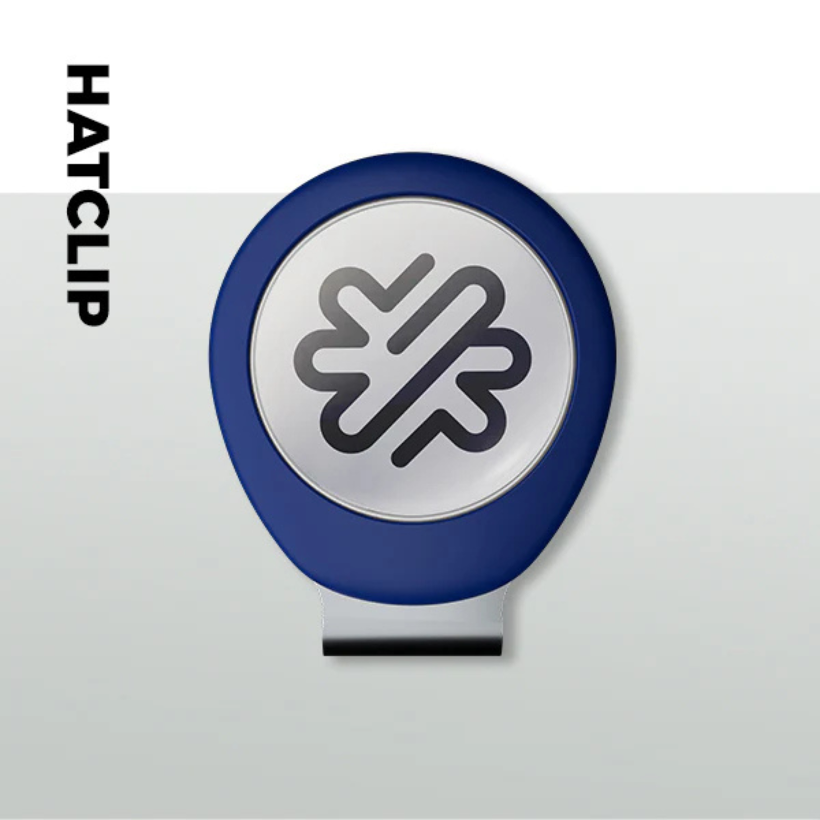 Navy blue hatclip with integrated magnet, featuring a white circular face with gray cloverleaf design and black attachment clip