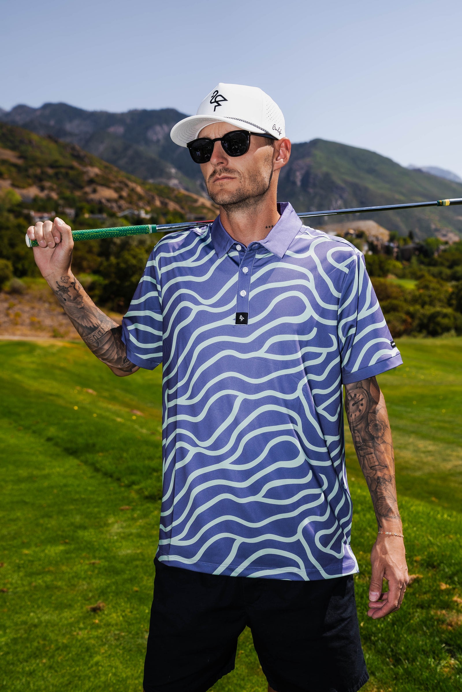 Men’s mint green and chocolate swirl pattern polo – bold, breathable, stretch-performance shirt.