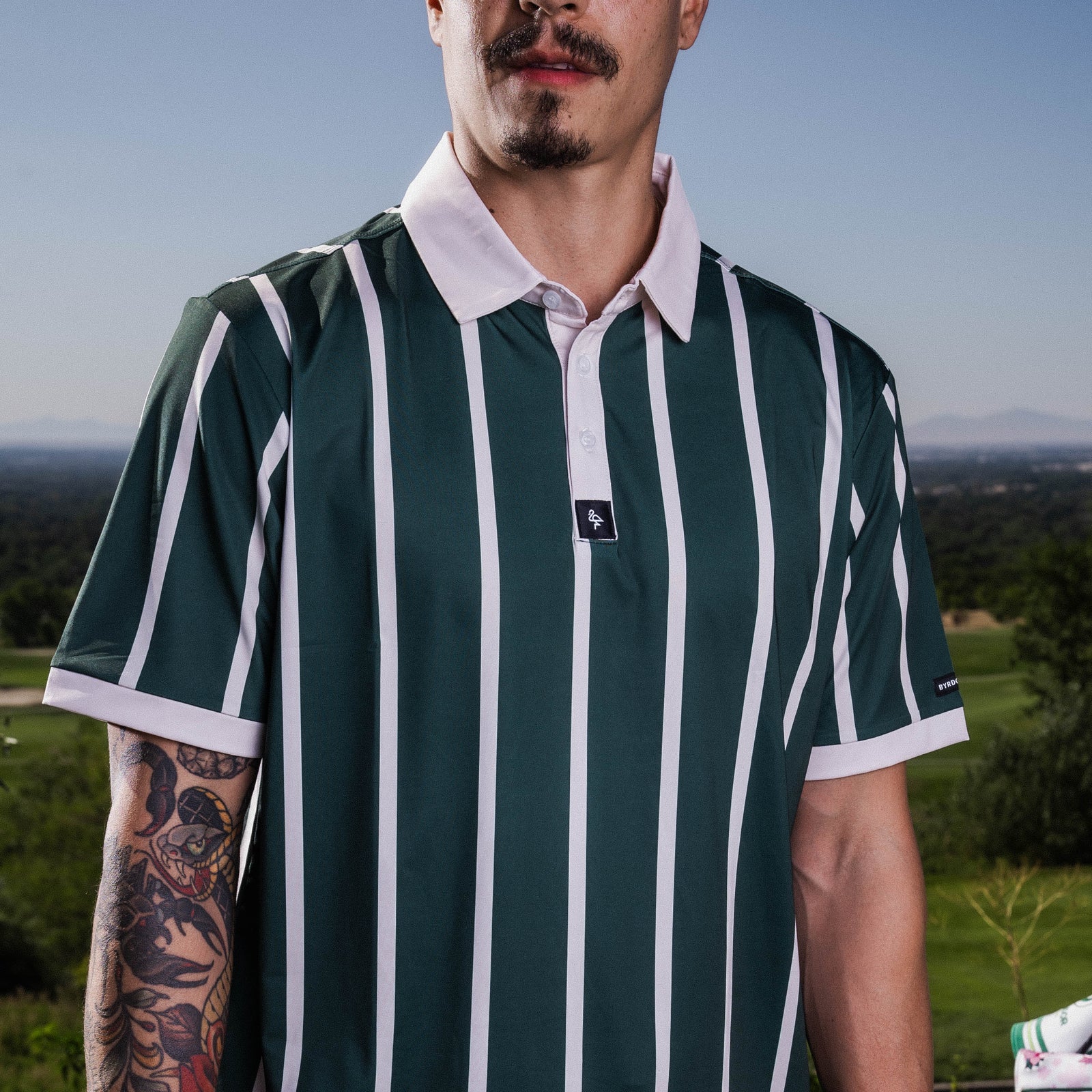 Men's green polo with retro horizontal stripes – athletic, breathable, stretch fit perfect for casual wear, golf, or travel.
