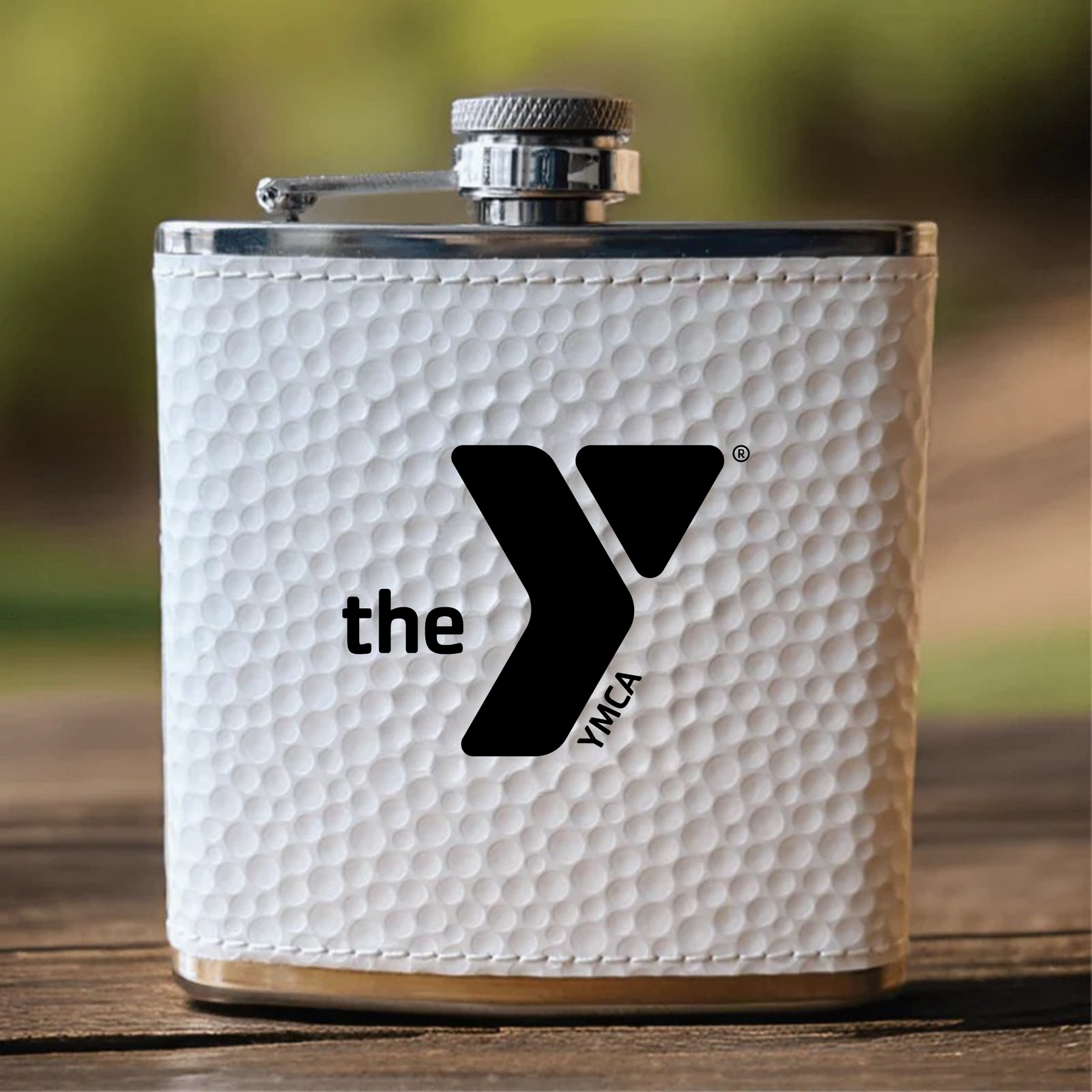 White golf-ball-textured flask with stainless steel cap and trim, printed with organization logo and text on front.