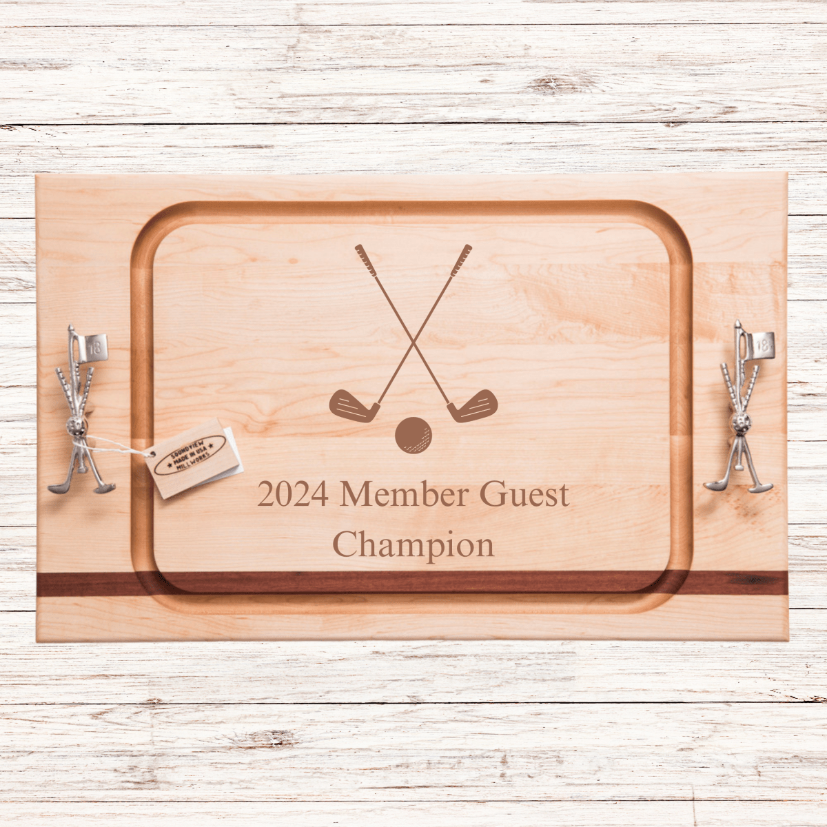 Wooden serving board with crossed golf clubs and ball engraved in center, customized with sample text "2024 Member Guest Champion", metal golf club handles on sides