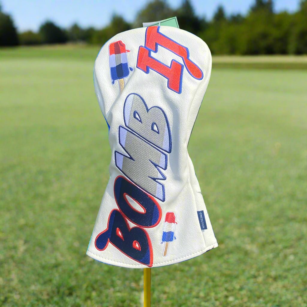 Bomb-themed headcover attached to a golf driver