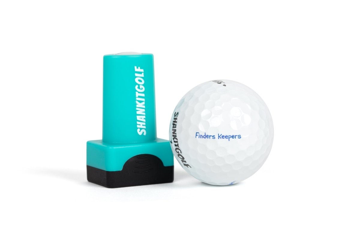 Turquoise and black ball stamper with "SHANKITGOLF" text next to white golf ball stamped with sample text "Finders Keepers" in blue
