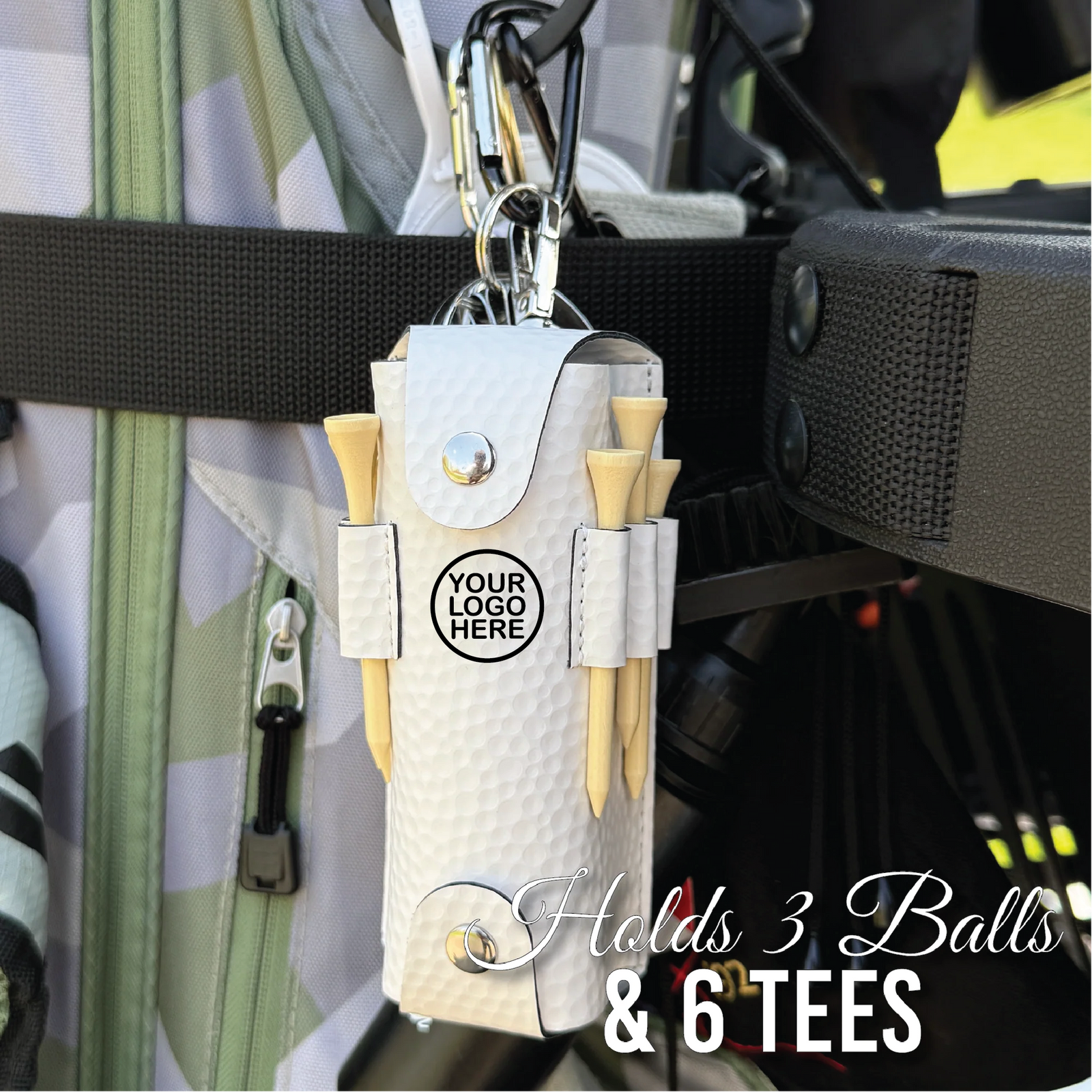 White leatherette golf ball pouch with carabiner clip attached to golf bag, showing sample logo placement and holding three wooden tees and golf balls
