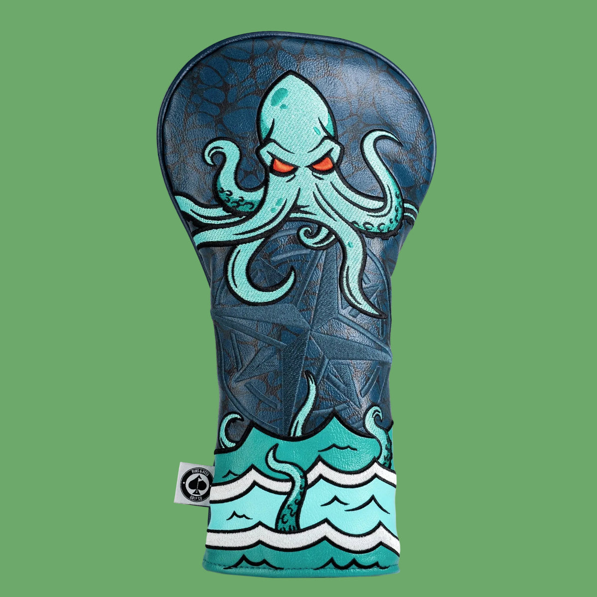 Kraken golf driver headcover in navy vegan leather with embroidered teal octopus and ocean wave design