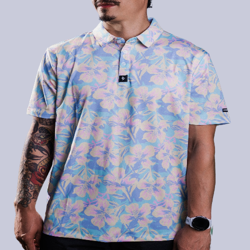 Men&#39;s off-white polo with pastel watercolor petal print – floral elegance with performance stretch and sun protection.