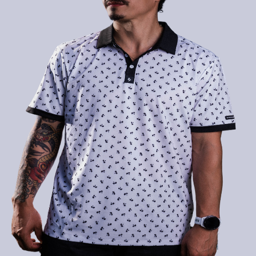 Men’s white polo with small navy palm leaf print and contrast collar – tropical-infused, stretch-performance ready.