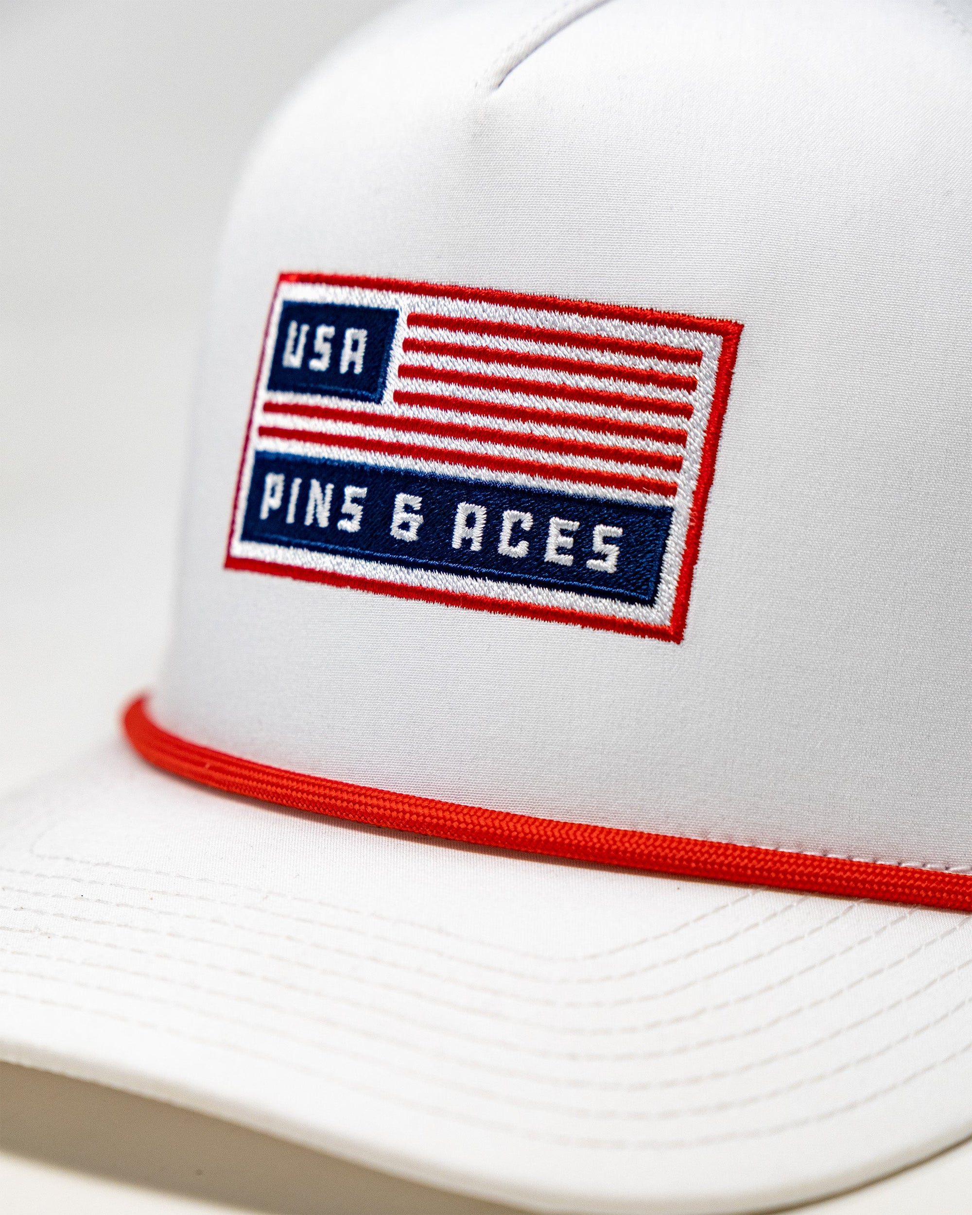 White USA golf hat with rope bill and magnetic ball marker holder