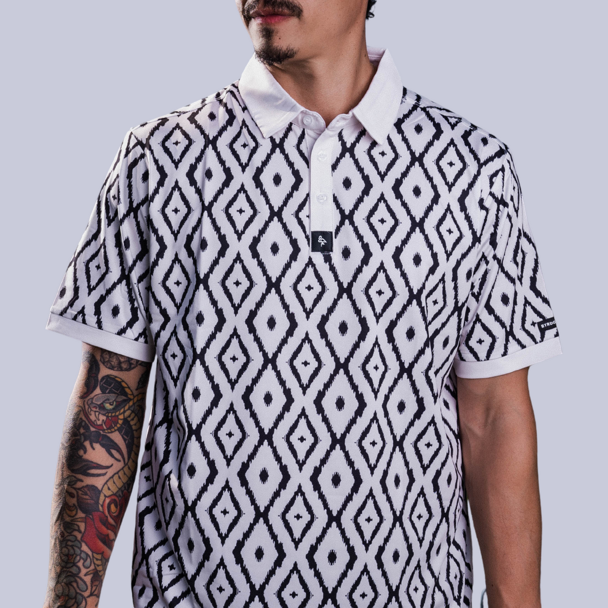Men’s polo with blue neutral ikat geometric print – cultured, breathable, stretch-performance ready.