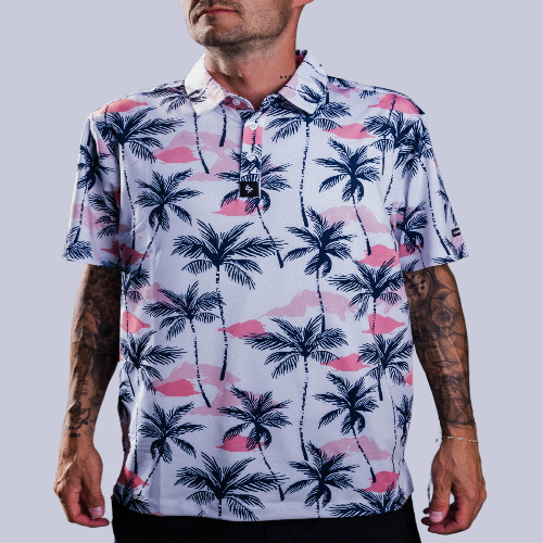Men’s white polo with vibrant green and pink palm tree print – tropical feel with stretch, moisture control, and wrinkle resistance.