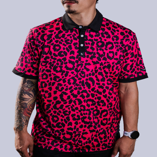 Men’s hot pink polo with black micro-spot pattern – bold, breathable, and stretch-fit performance.