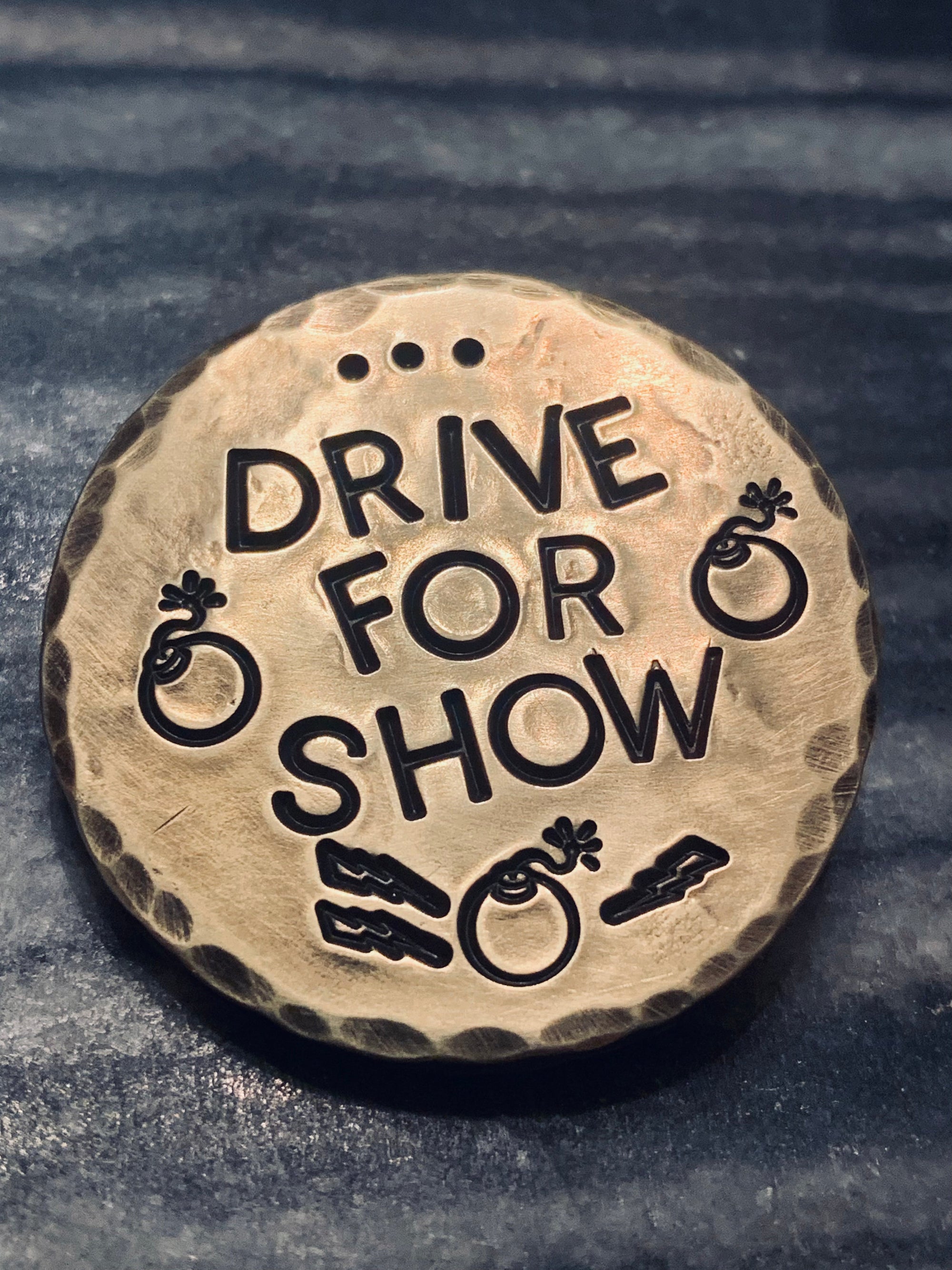 brass golf ball marker engraved with Drive for Show and Putt for Dough