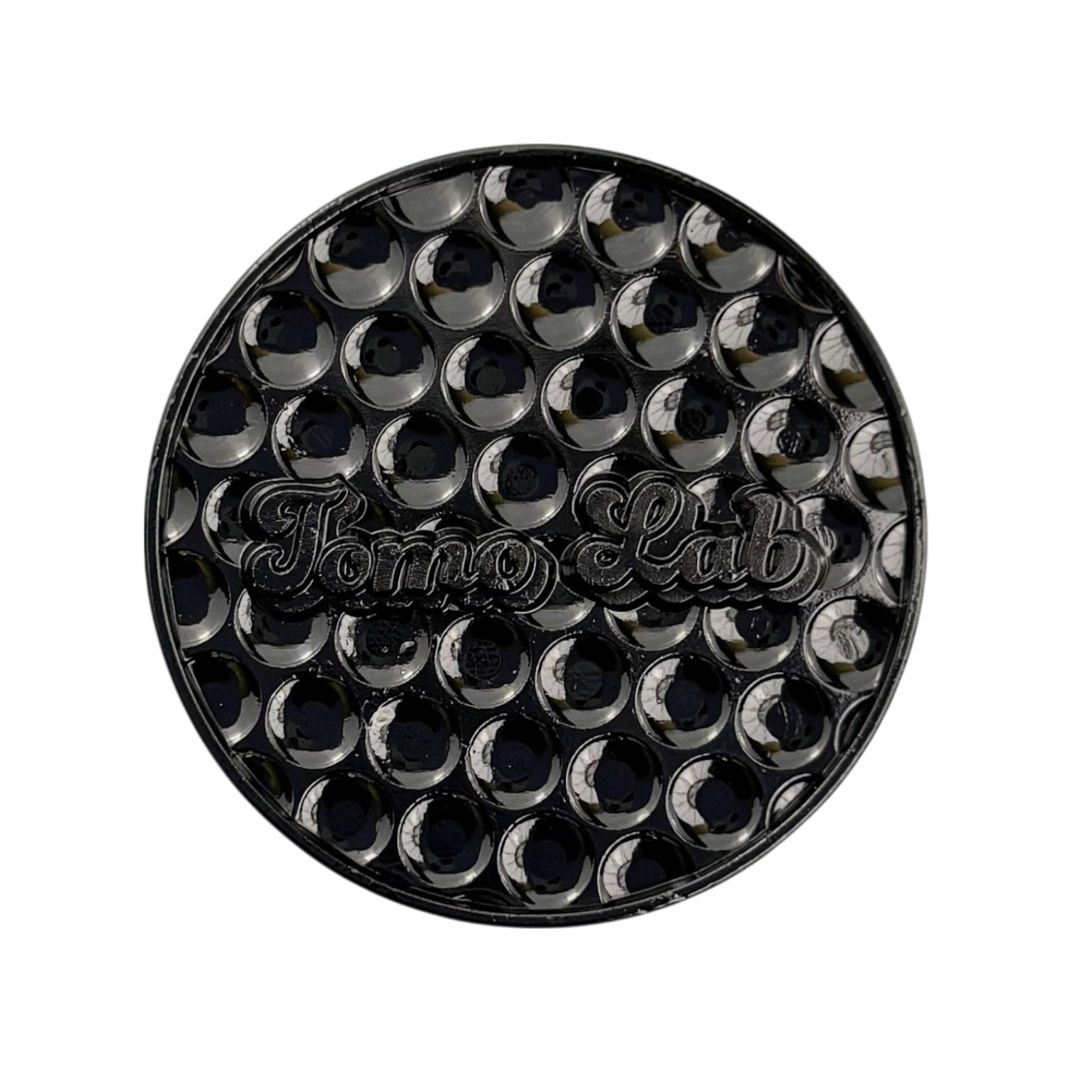 Manhole‑cover style golf ball marker with street‑wise texture and metal finish