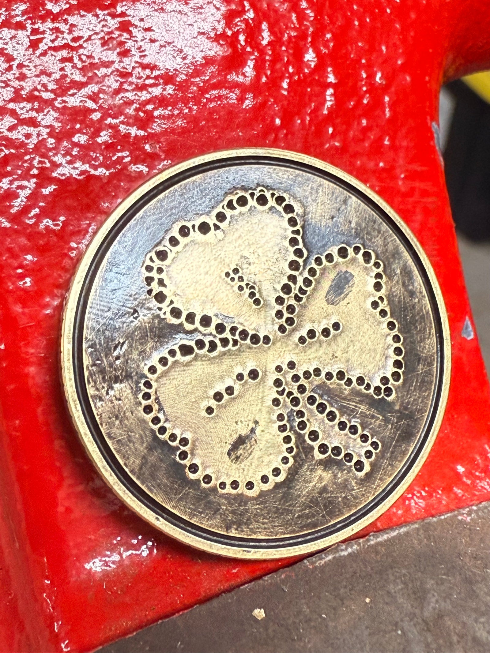 golf ball marker with "Lucky" design