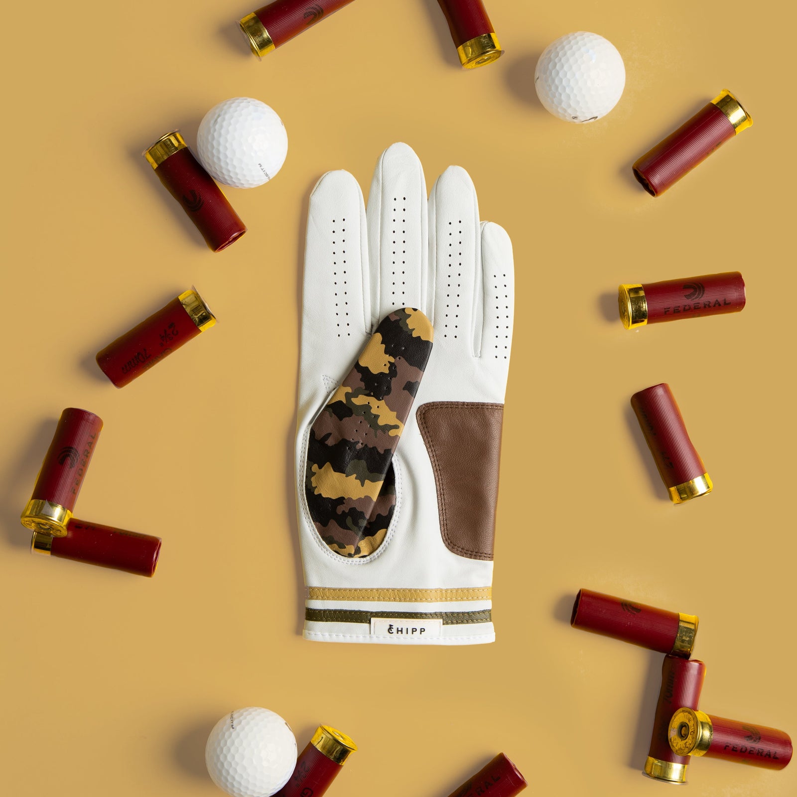 camo golf glove with brown leather palm and thumb detail