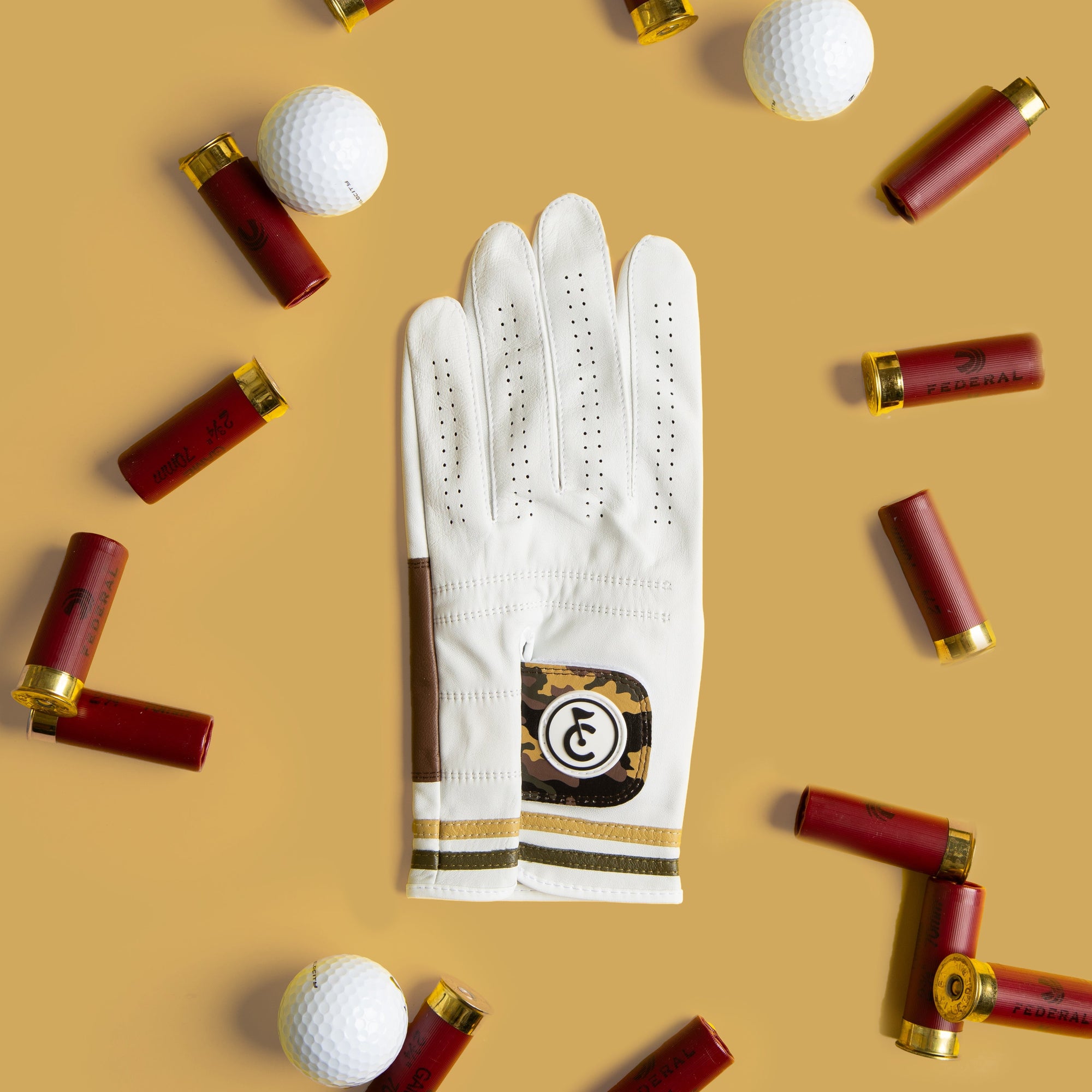 camo golf glove with brown leather palm and thumb detail