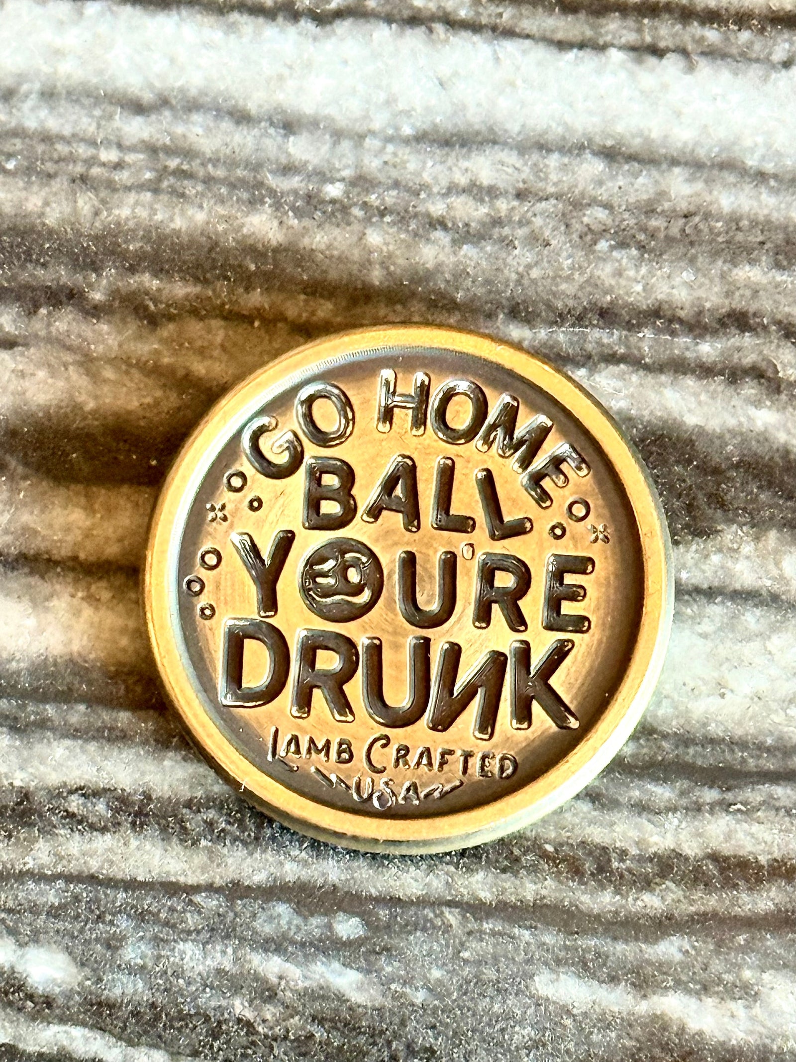 brass golf ball marker with “Go Home Ball, You’re Drunk” text