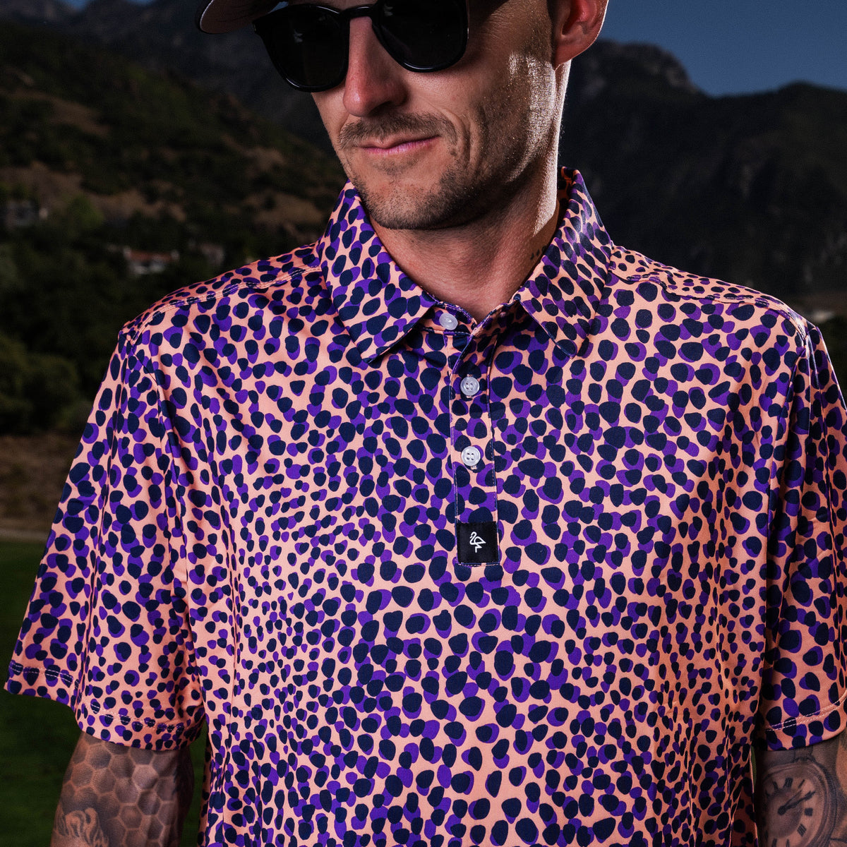 Men’s purple and tan leopard-print polo – bold animal print with stretch-performance and sun protection.
