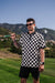 Men’s black-and-white checkerboard polo – retro-inspired, breathable, stretch-performance ready.