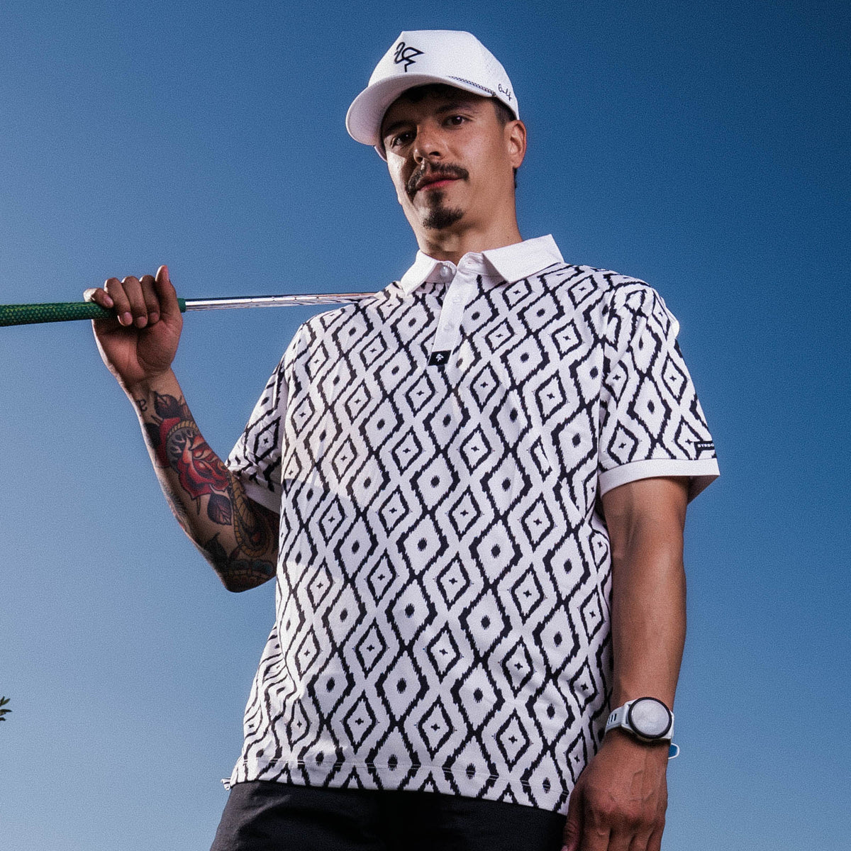 Men’s polo with blue neutral ikat geometric print – cultured, breathable, stretch-performance ready.