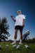 Men’s white polo with subtle grey-black dot “cosmic sprinkle” pattern—sleek, breathable, and performance-ready.