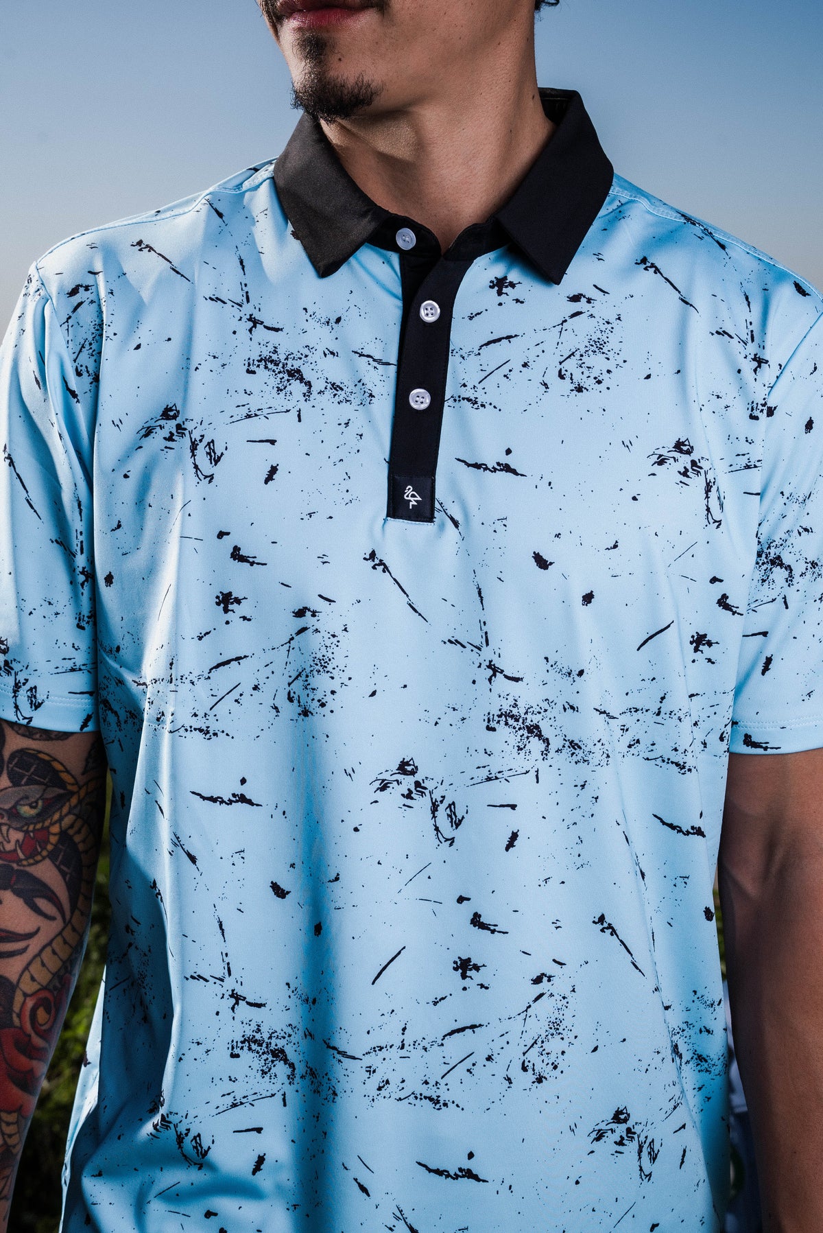 Men’s deep blue polo with subtle water‑ripple texture – breathable, stretch fit with moisture control and wrinkle resistance.