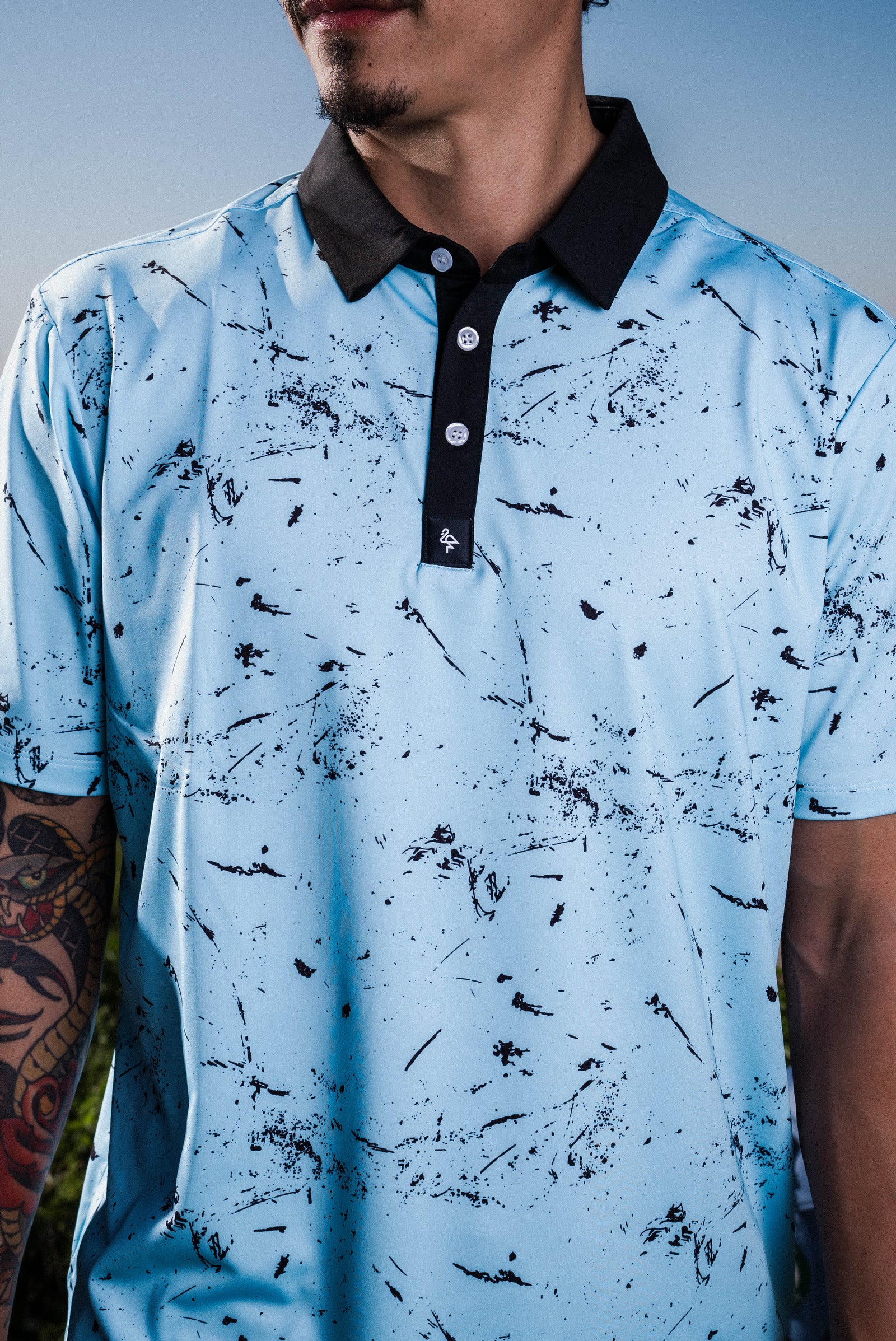 Men’s deep blue polo with subtle water‑ripple texture – breathable, stretch fit with moisture control and wrinkle resistance.