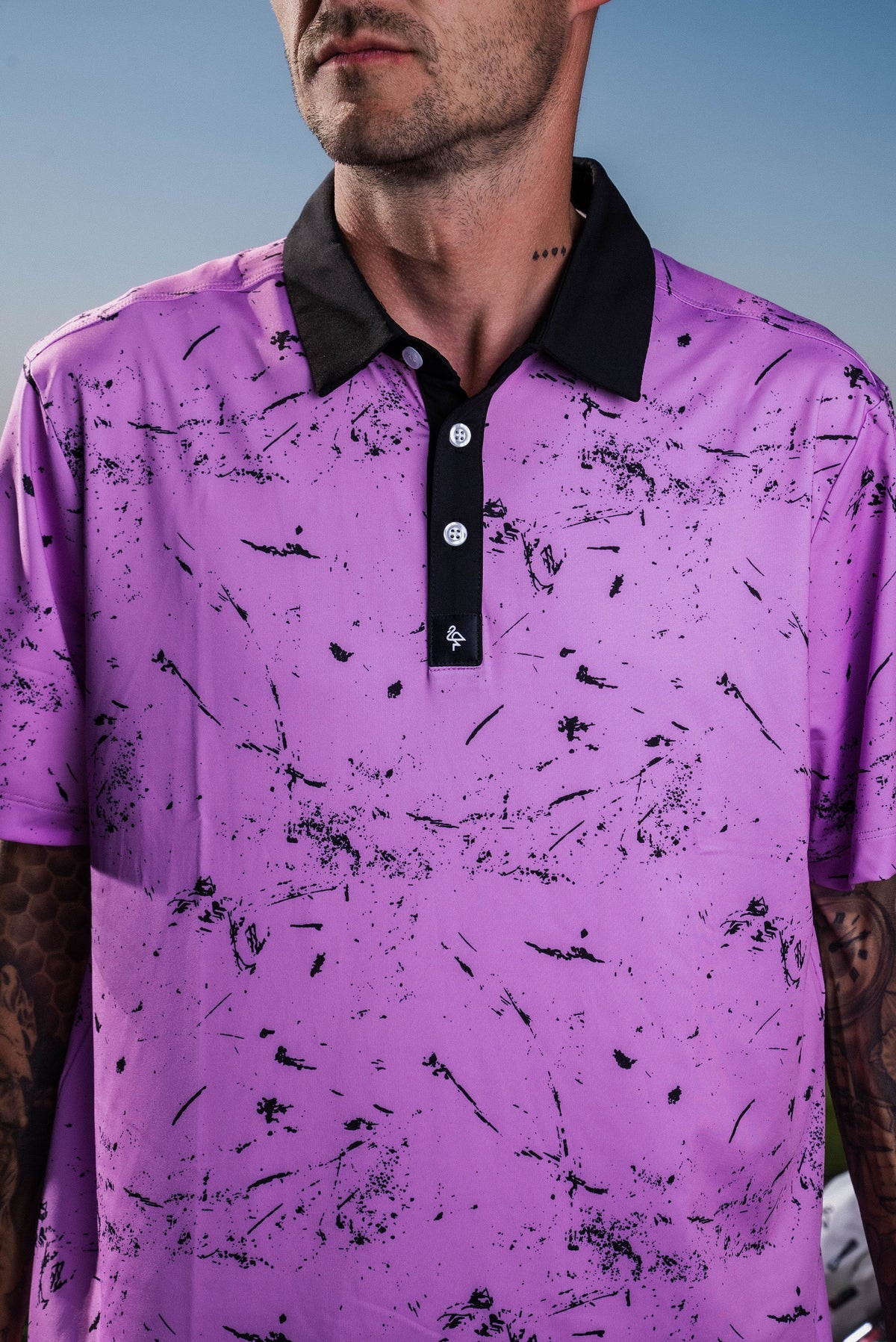 Men’s soft pink polo with light drip texture pattern – breathable, stretch-performance shirt with subtle visual depth.