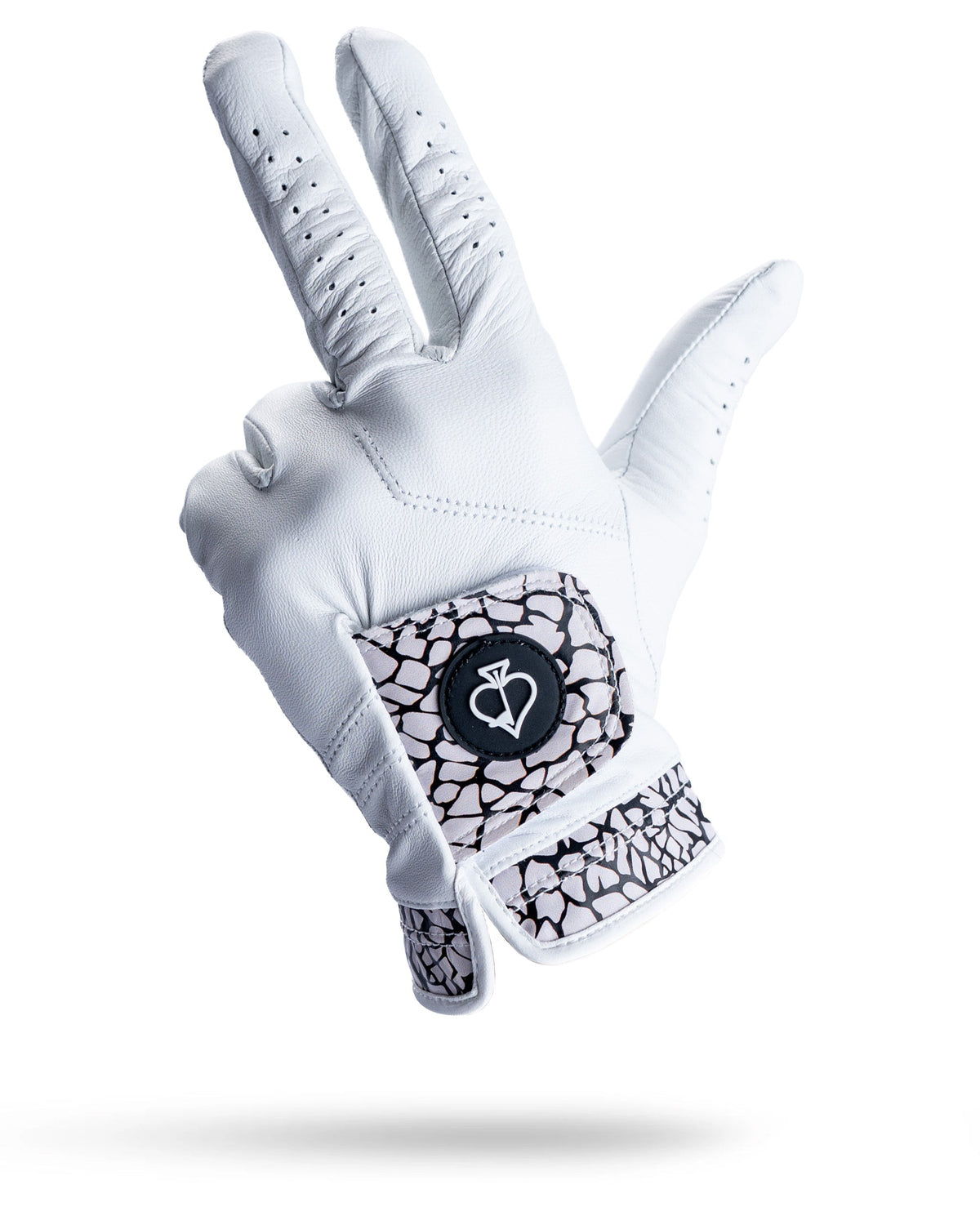 White AAA Cabretta leather golf glove with black and white elephant print cuff and thumb detail