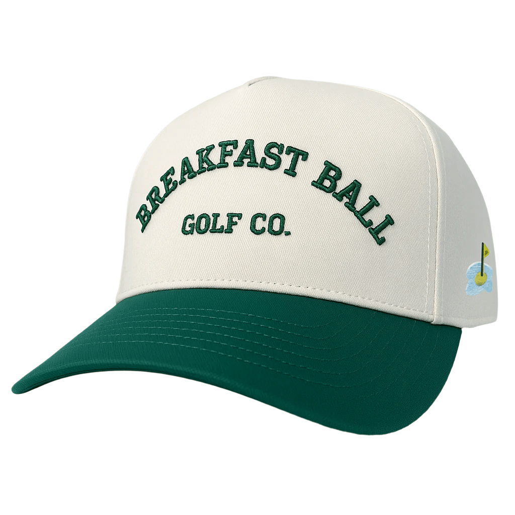 White and green cap with &#39;Breakfast Ball Golf Co.&#39; text on a white background