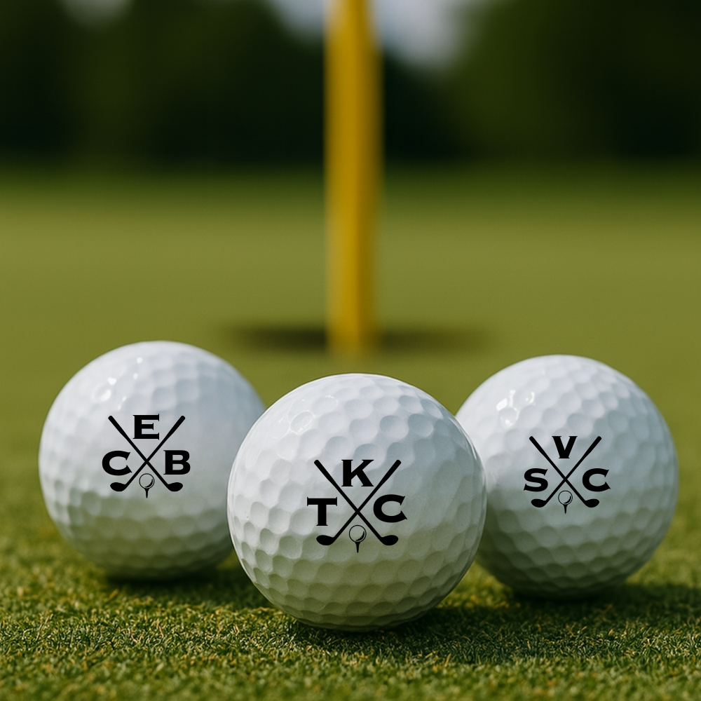 Personalized golf balls with initials and crossed club logo