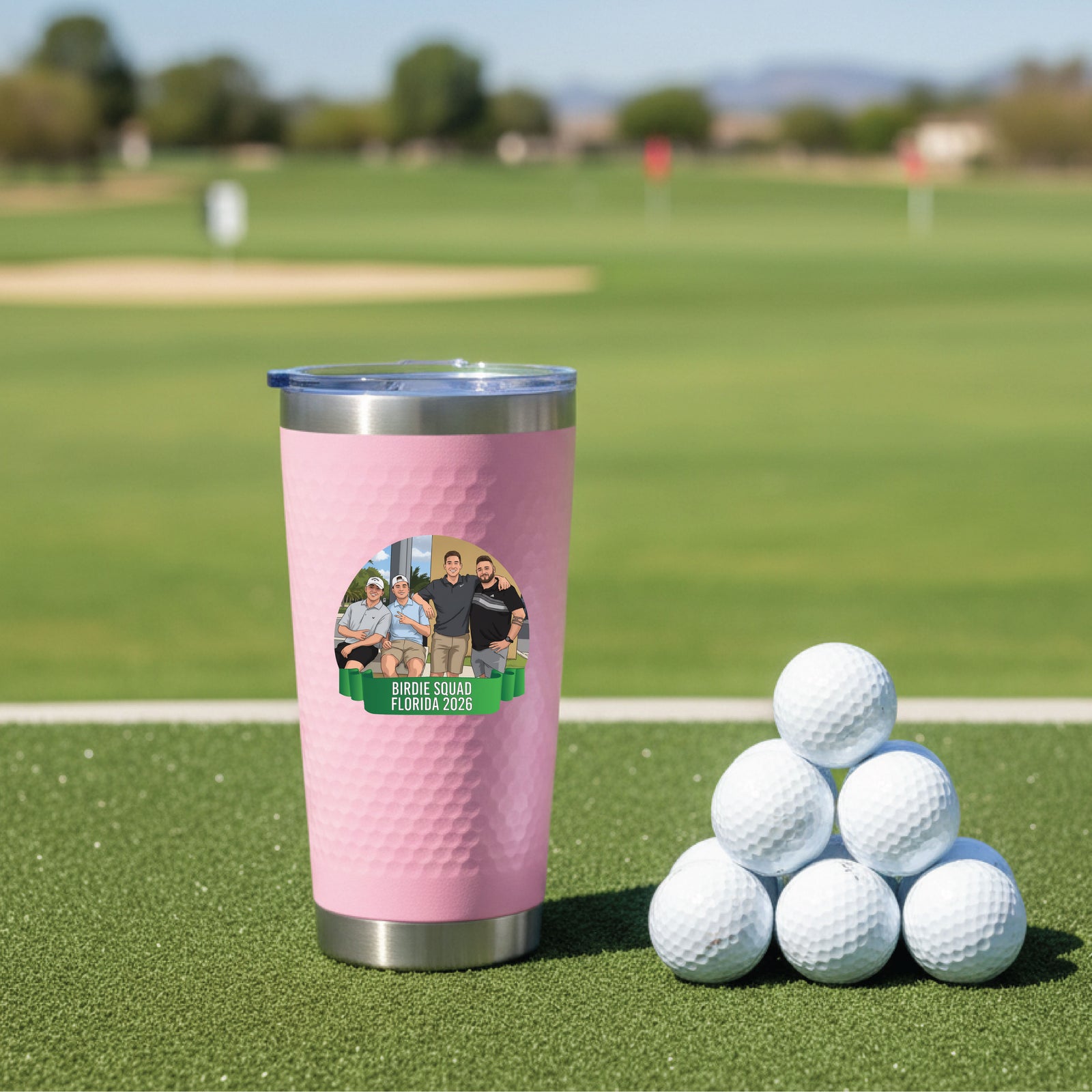 Pink insulated tumbler with sample photo graphic labeled "Birdie Squad Florida 2026" displayed on golf course with golf balls nearby