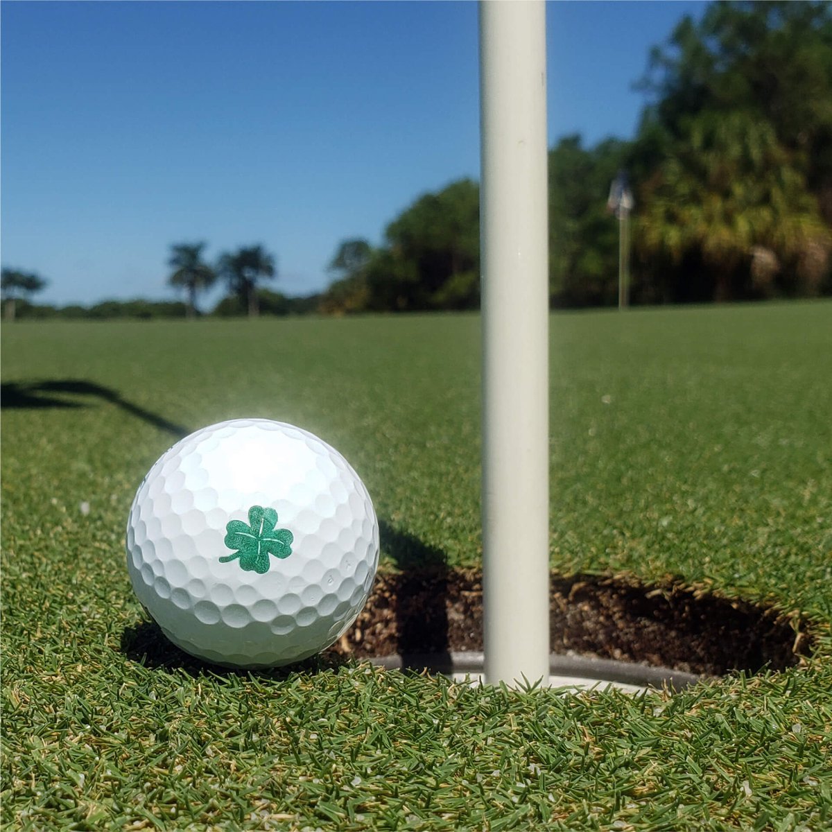Lucky Clover golf ball stamp marking tool for quick identification.