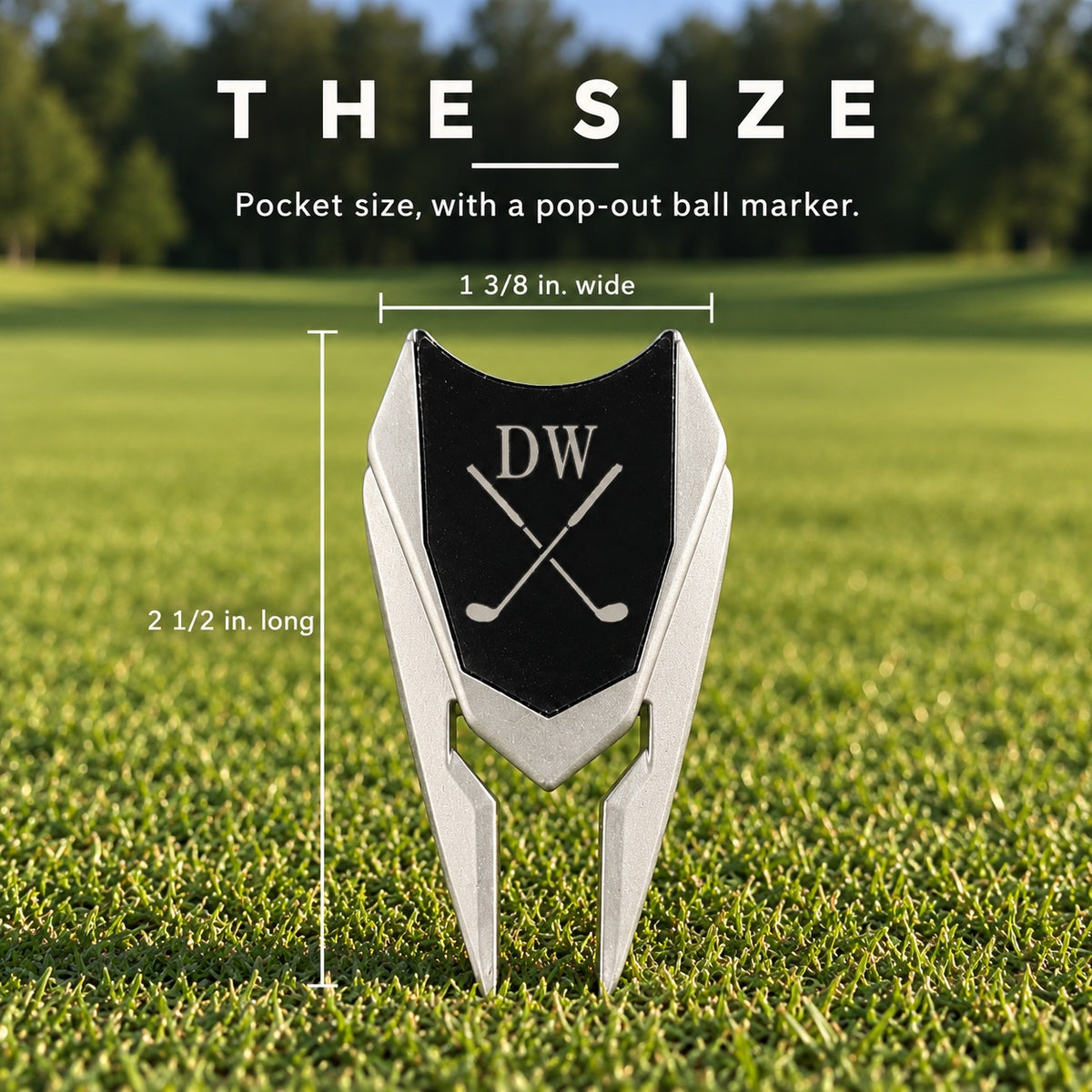 Size of the Earth Adjuster golf divot tool: 2 1/2 inches long and 1 3/8 inches wide, shown upright on the green with the initials DW engraved