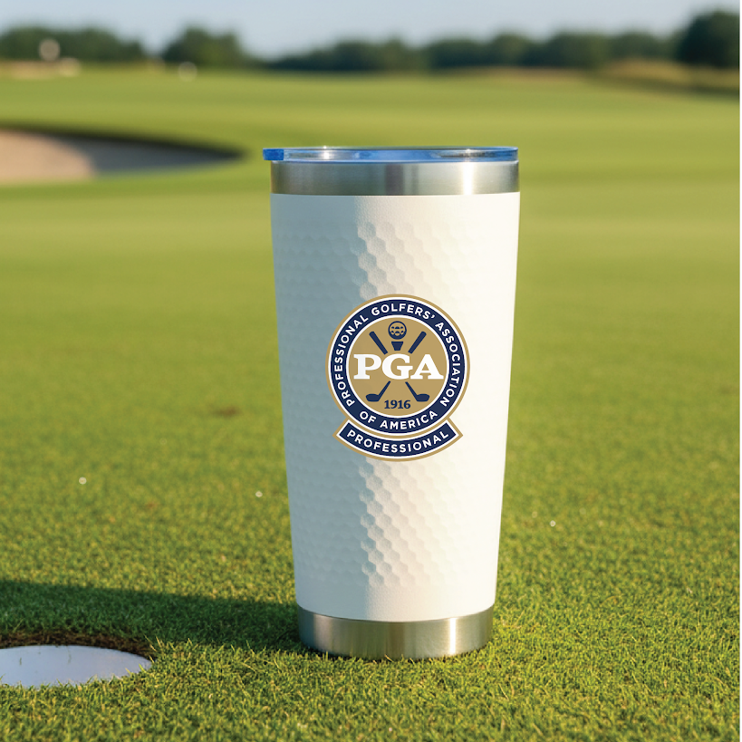 White tumbler with PGA logo on a golf course
