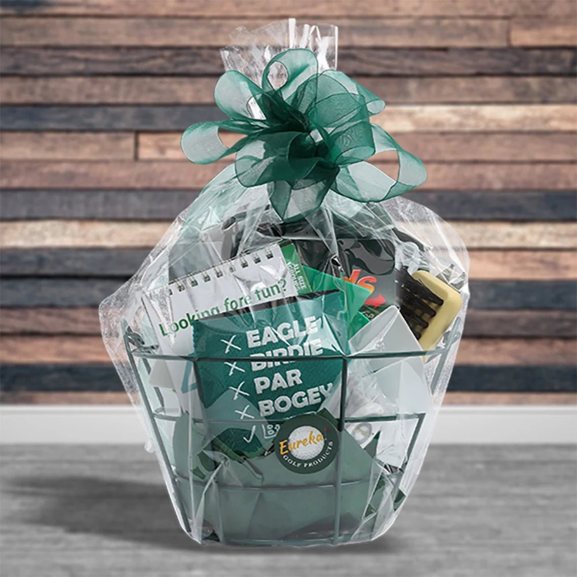 The open Golf gift basket with 13 Golf Accessories in a green wire basket