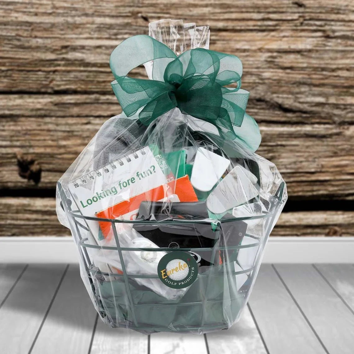 Eagle Golf Tournament prize basket with 17 golf accessories in green wire basket