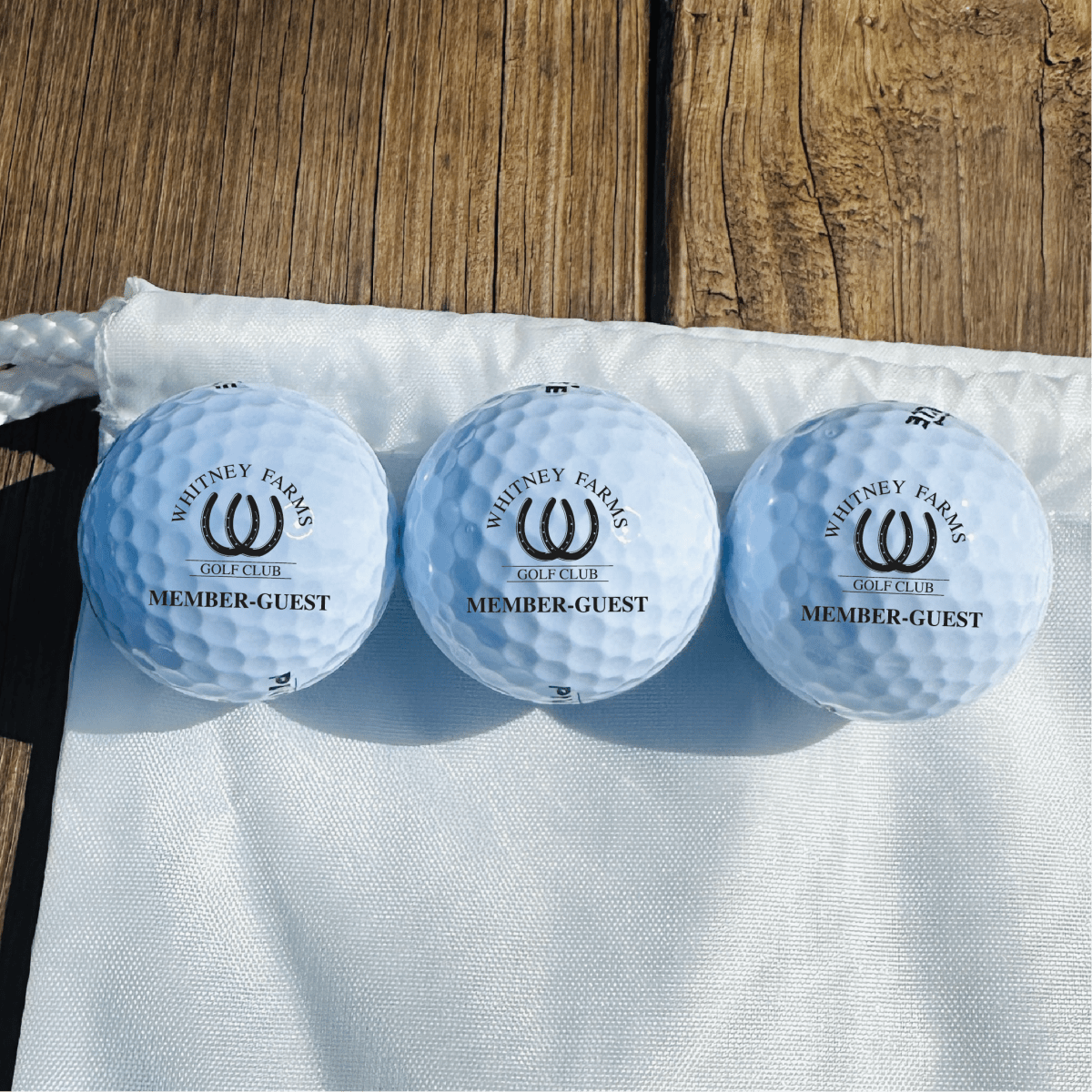 Custom golf swag bag with personalized golf balls and accessories