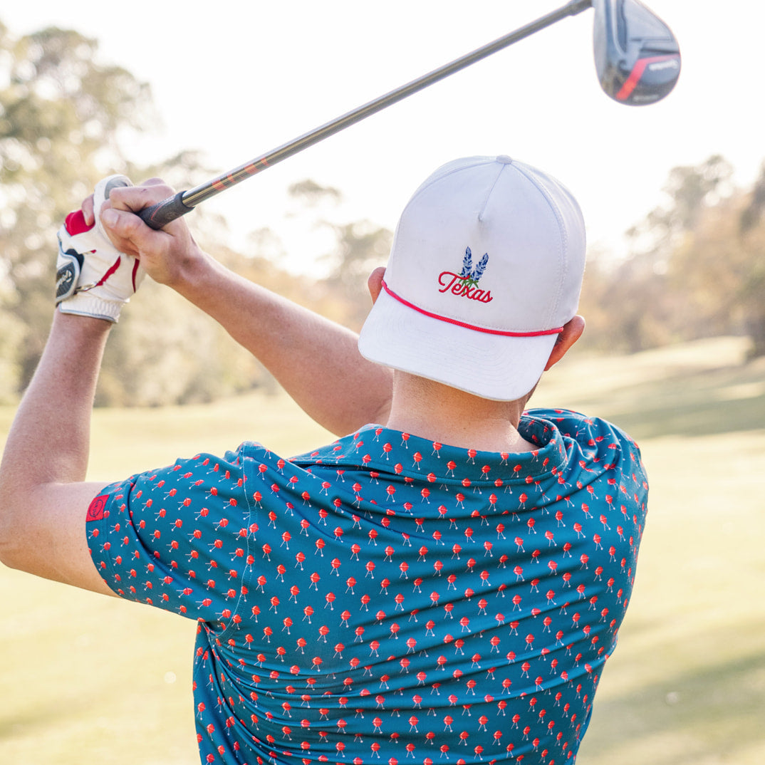 Backswing of Golfer In Texas Hat 
