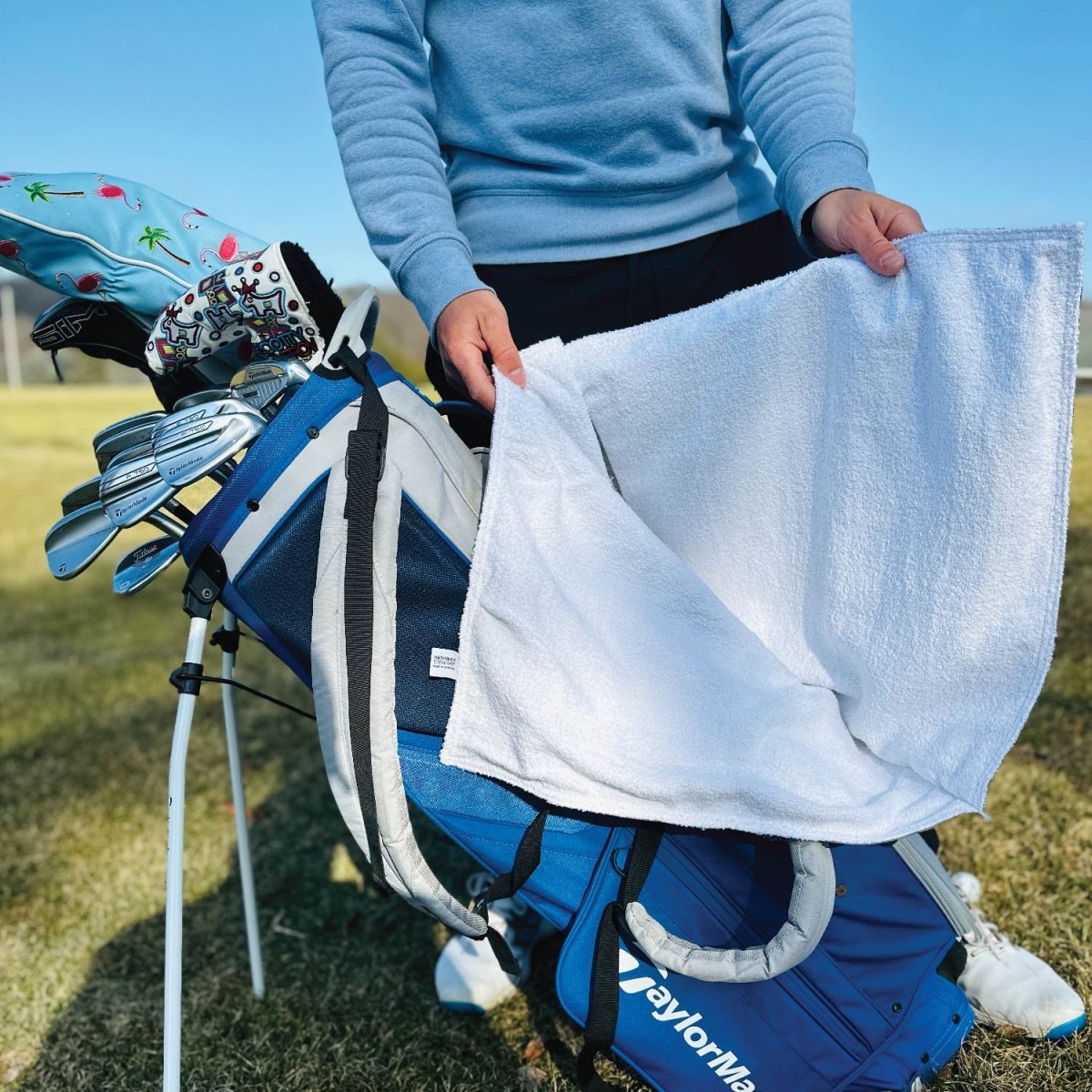 Custom all-weather golf towel attached to a golf bag