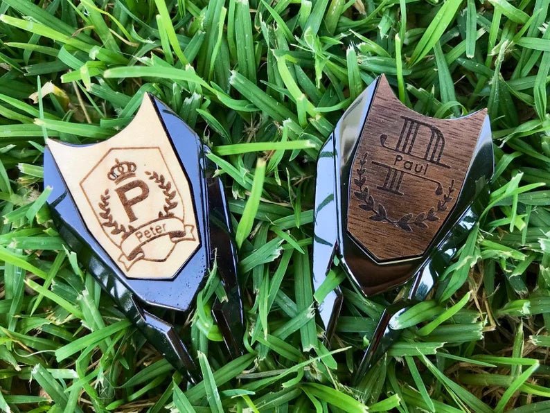 Golf divot tool with custom material, design, and engraving options.